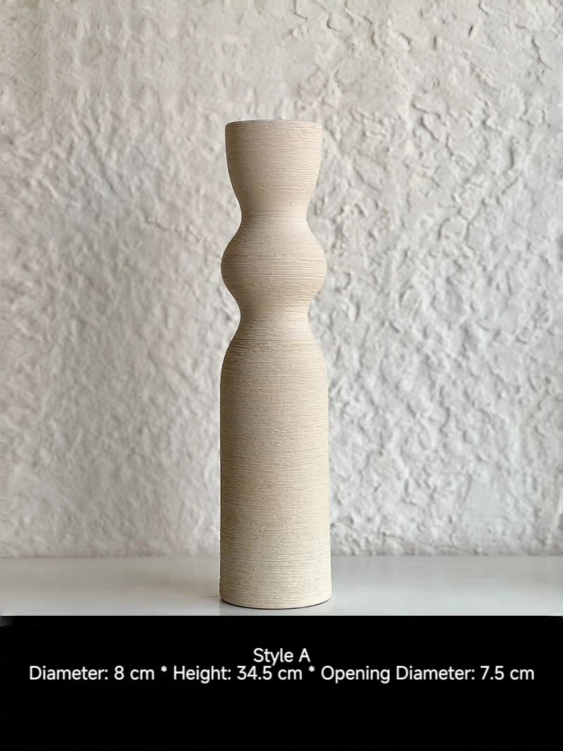 ribbed geometric ceramic vases in black, sand, and terracotta, minimalist organic pottery for shelf styling.