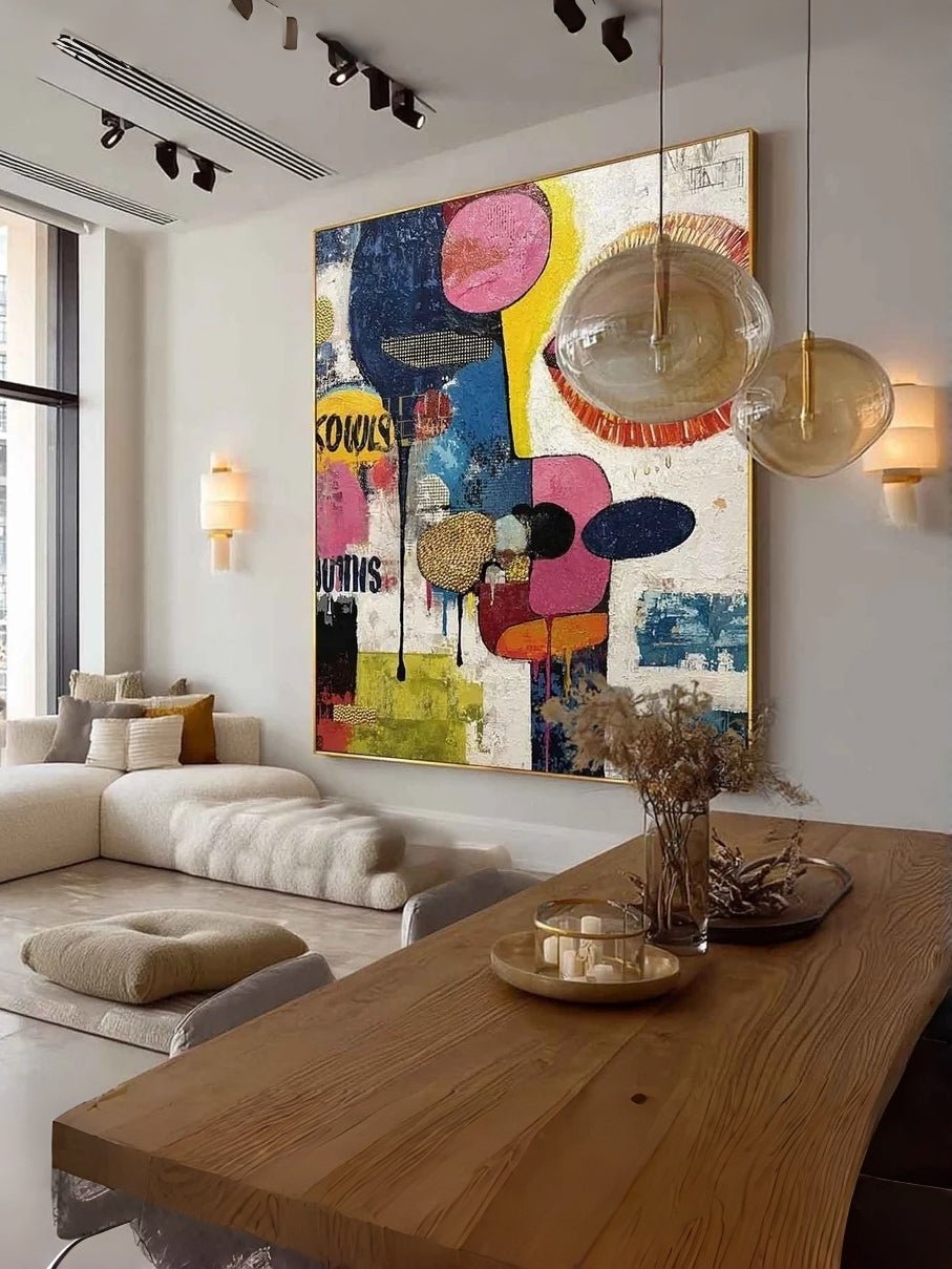 Large colorful hand-painted pop art abstract face with blue eye and graffiti drips, modern textured canvas wall art by Kaelan Slate for home office decor.