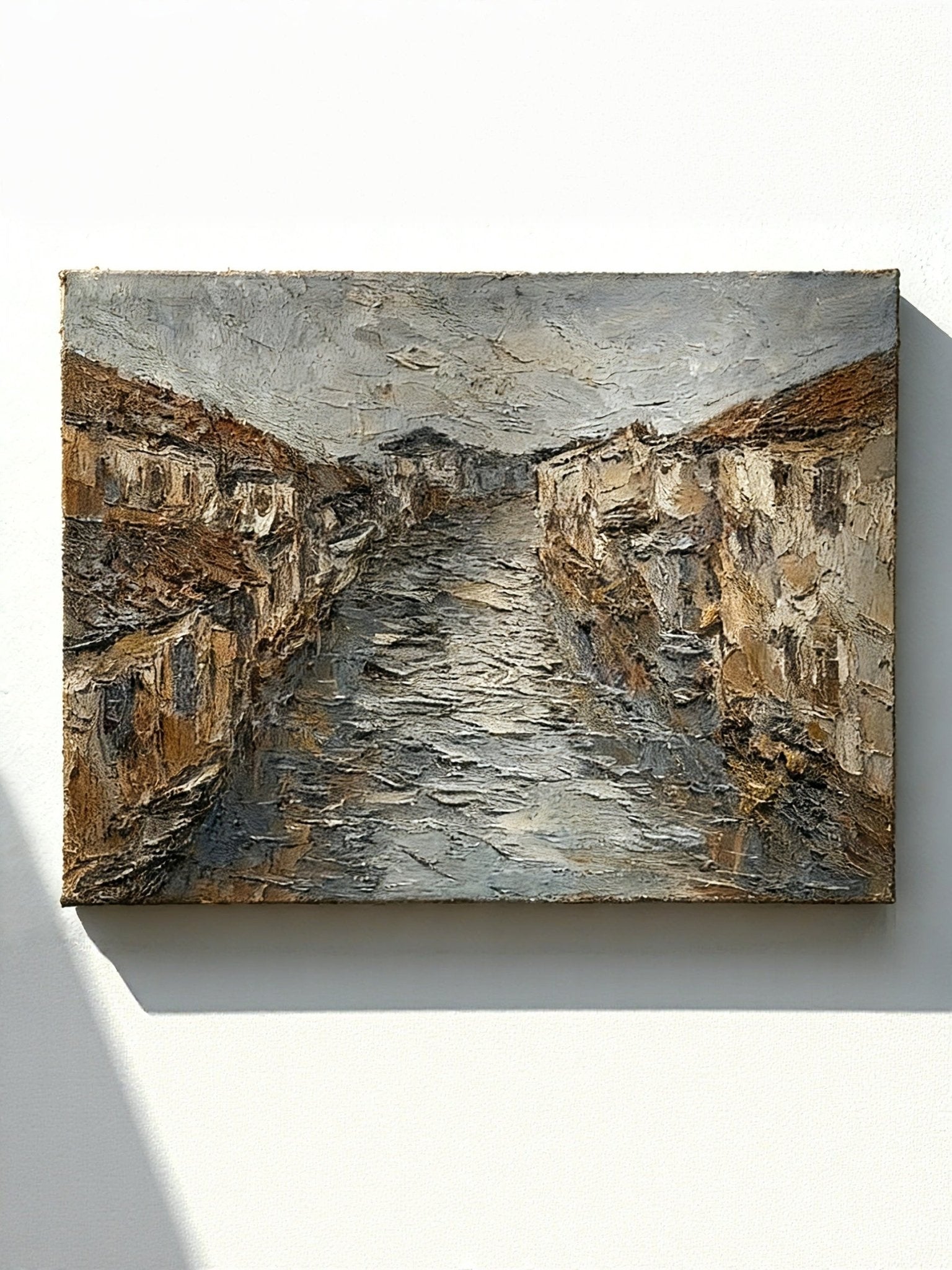 Hand-painted textured oil painting of a European riverside town with 3D impasto effect on canvas
