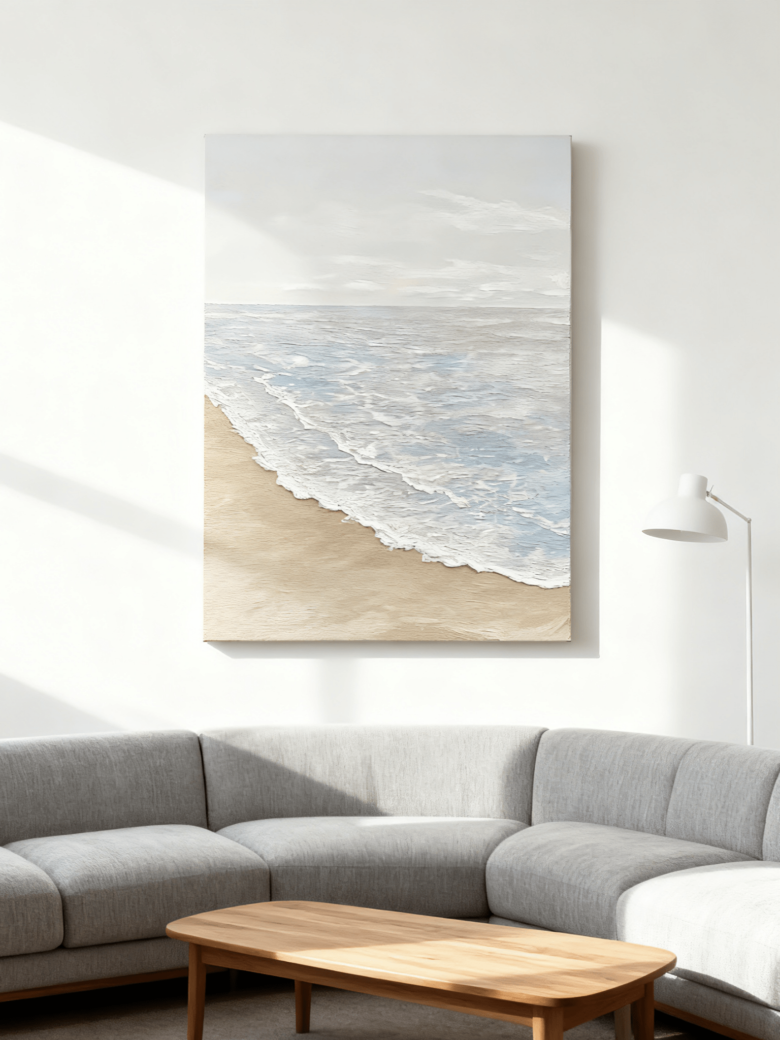Textured beach painting displayed in modern living room, showcasing coastal wall art in home decor setting