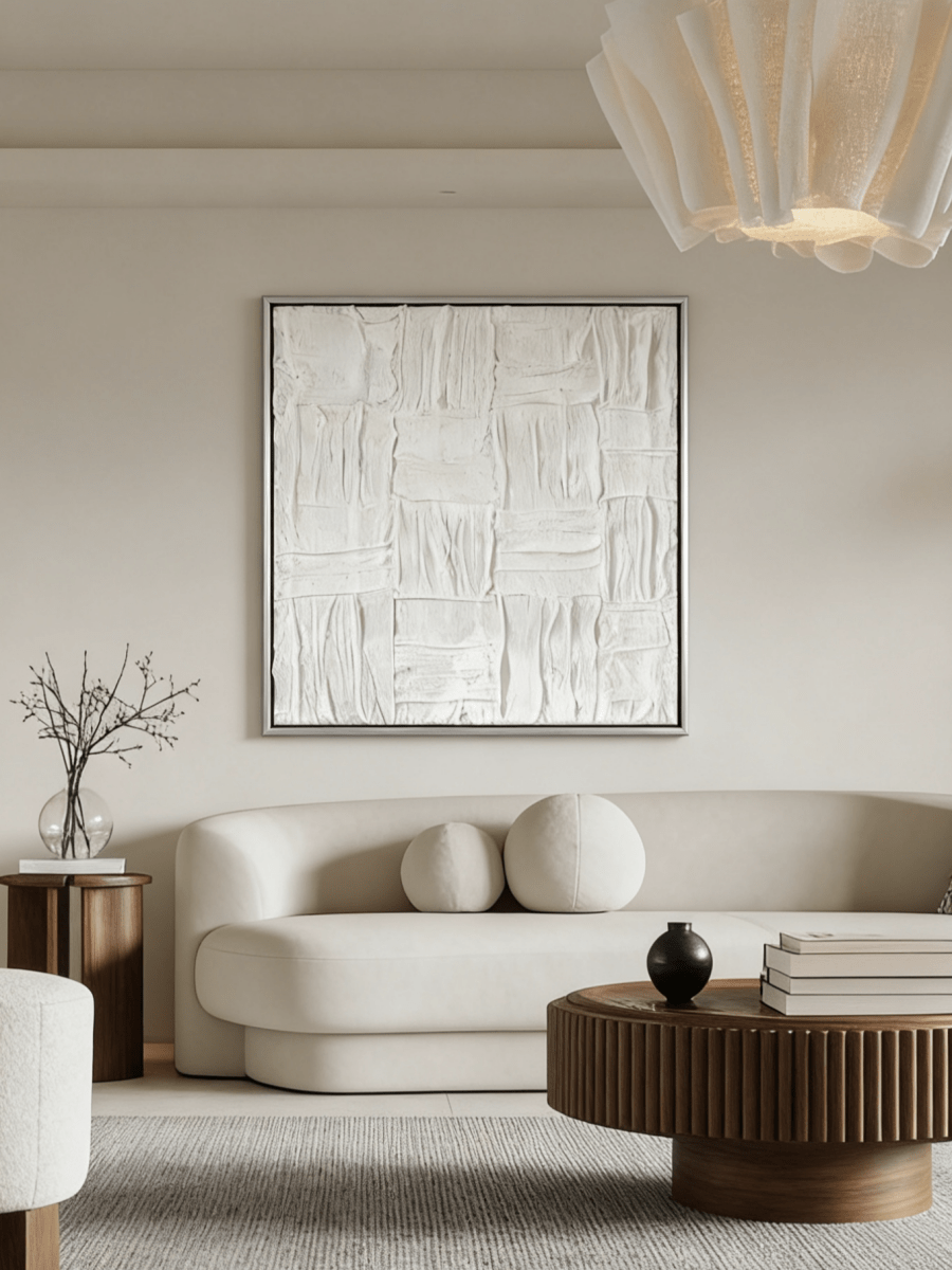 Close-up of the hand-painted white textured canvas art featuring heavy impasto weave pattern in a gold floater frame.