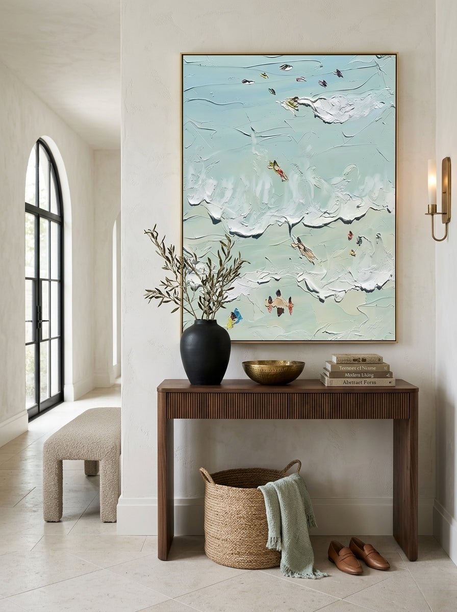Hand-painted textured coastal surf wave wall art featuring ocean waves and surfers in soft aqua tones on canvas