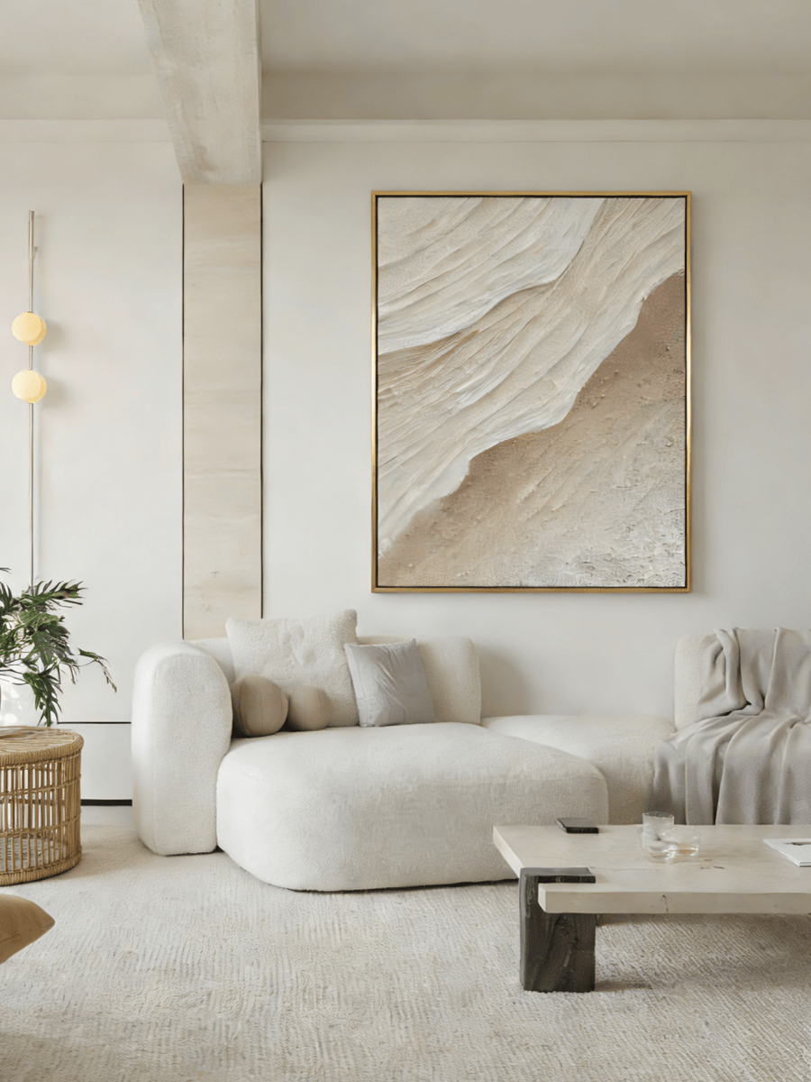 Large vertical 3D textured abstract painting with heavy sand-colored impasto ridges in a modern minimalist living room.