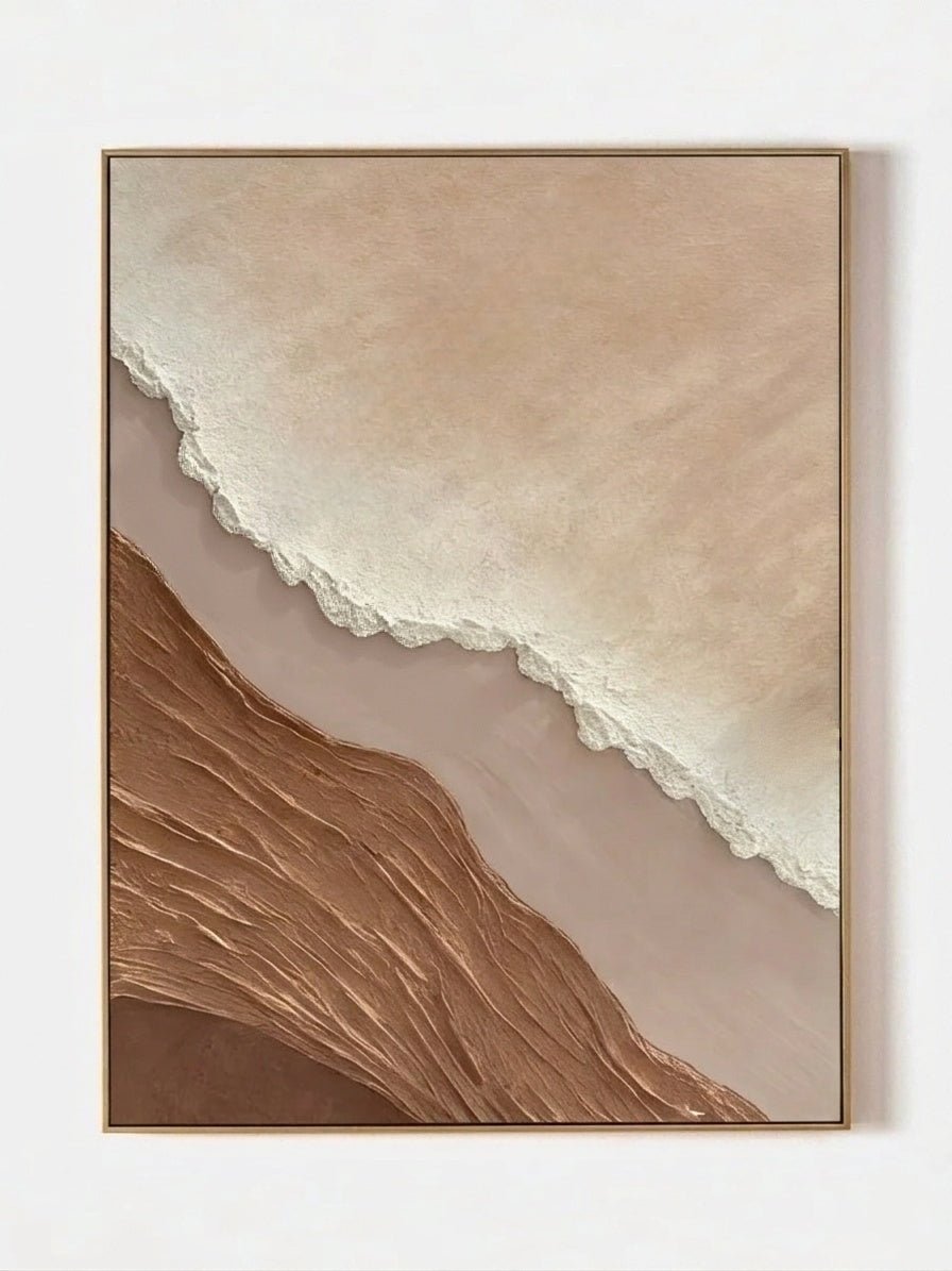 Close-up of a hand-painted 3D textured abstract beach painting featuring heavy wave-like ridges in sand beige and ochre in a gold frame.
