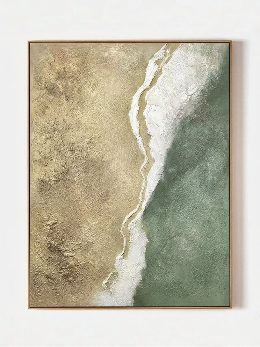 Close-up of a hand-painted 3D textured abstract beach painting with heavy white sculpted foam over sage green and sand backgrounds in a gold frame.