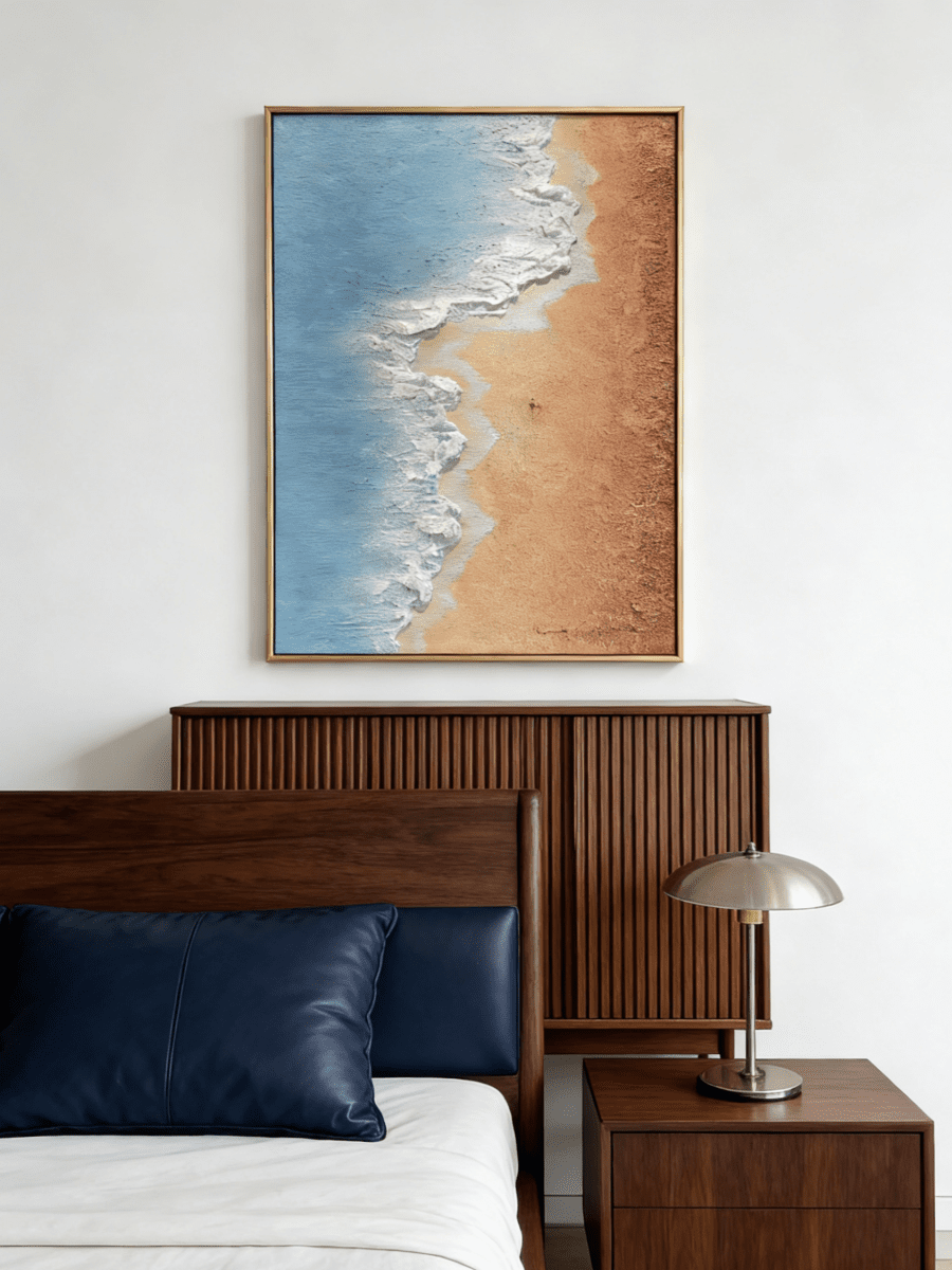 Hand-painted 3D textured aerial view of beach waves with heavy white sculpted foam and granular golden sand texture in a gold frame.