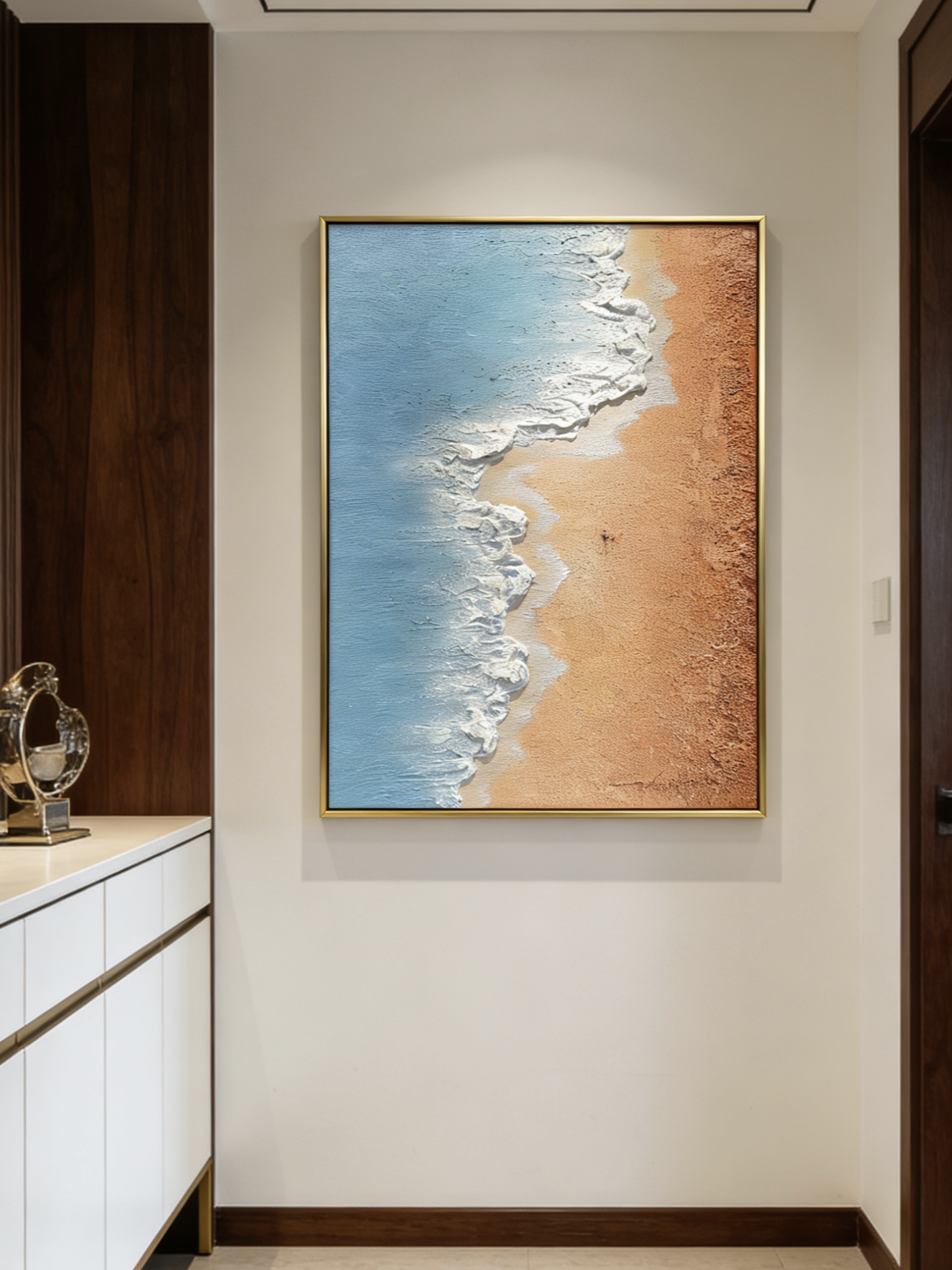 Hand-painted 3D textured aerial view of beach waves with heavy white sculpted foam and granular golden sand texture in a gold frame.