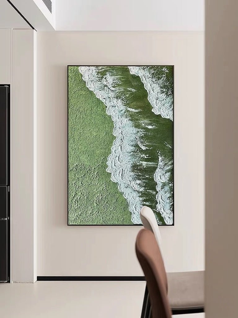 High-relief 3D textured painting showing white sculpted seafoam splashing over a deep forest green background in a gold frame.