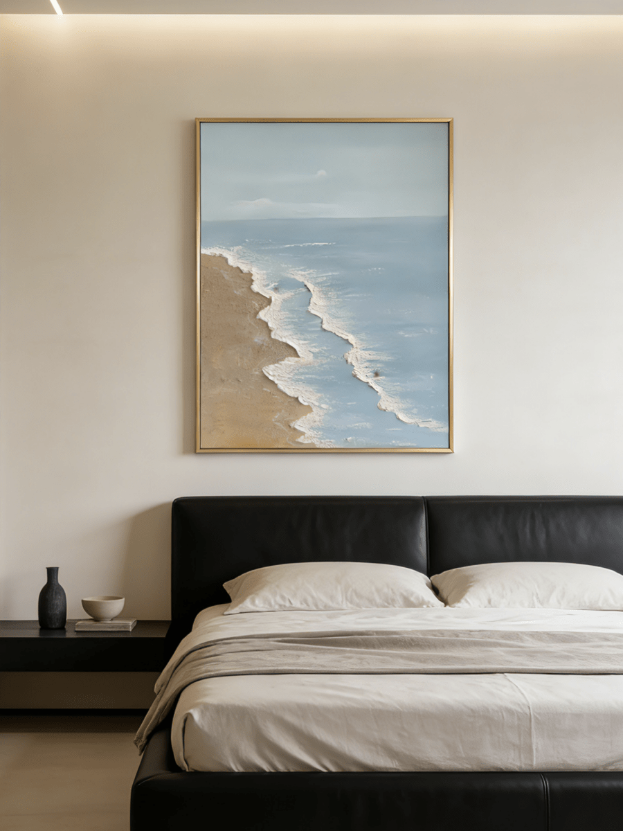 Large vertical hand-painted blue ocean painting with 3D textured white foam waves and sandy beach by Leo Liang in a bright modern bedroom.