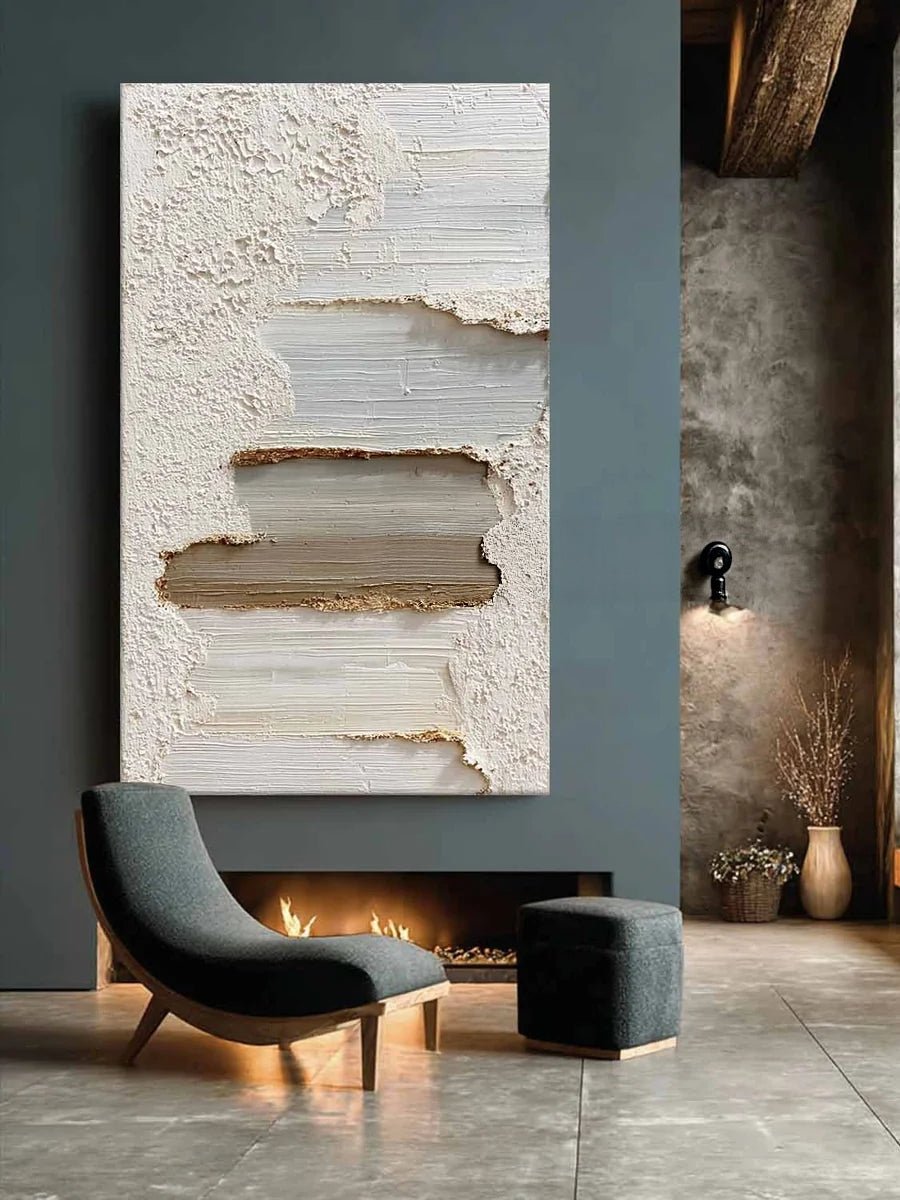 A tall vertical 3D textured abstract painting by Leo Liang featuring heavy plaster-like layers of white, taupe, and gray in a modern living room with a fireplace.