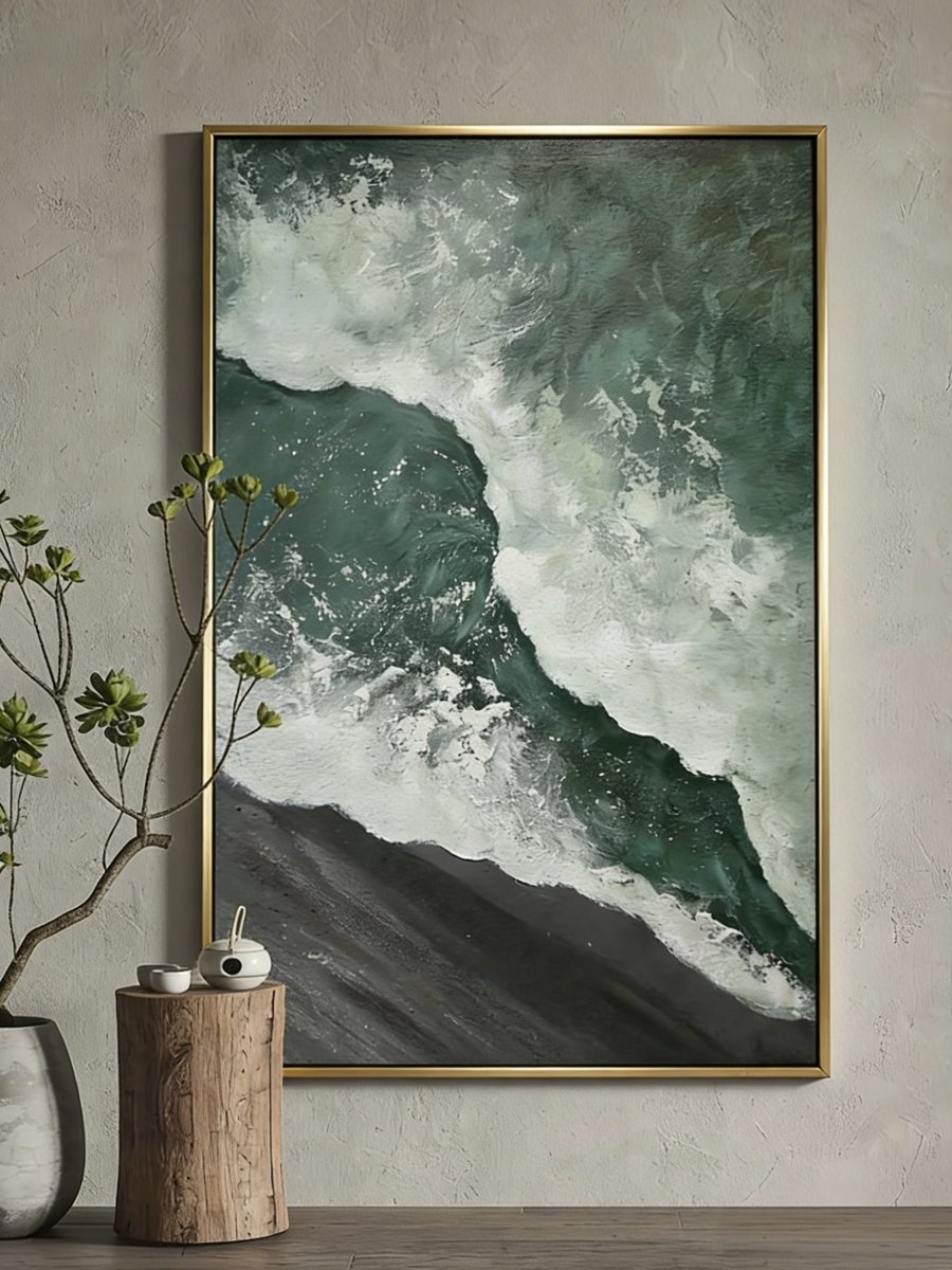 A large vertical 3D textured seascape painting by Leo Liang featuring deep emerald green waves crashing on a black sand shore, displayed in a modern living room.