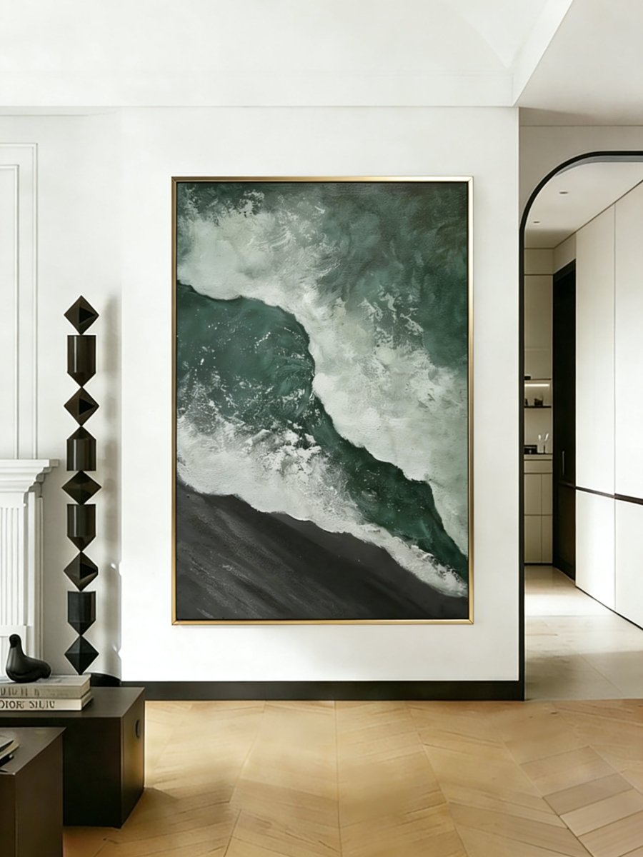 A large vertical 3D textured seascape painting by Leo Liang featuring deep emerald green waves crashing on a black sand shore, displayed in a modern living room.