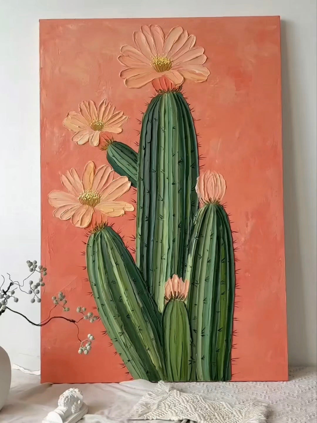 Large 100% hand-painted modern boho Southwestern cactus canvas painting with heavy 3D palette knife textured peach pink flower petals over a warm terracotta background by Luna Xiao for living room decor.