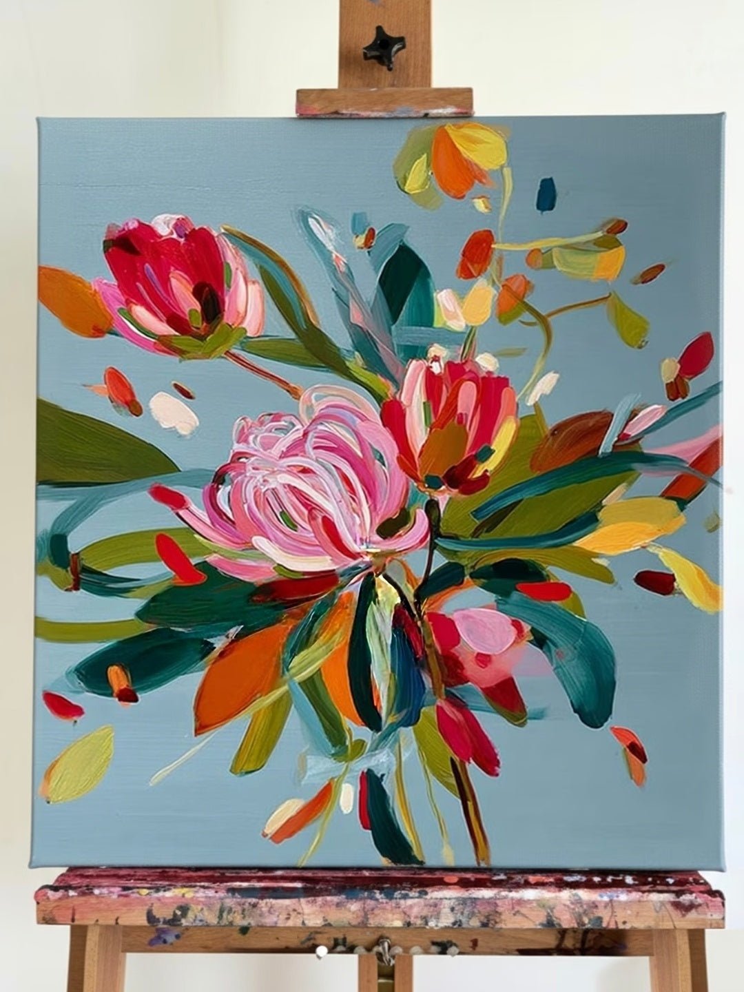 Large square hand-painted expressionist floral oil painting with vibrant pink and yellow flowers on a slate blue background