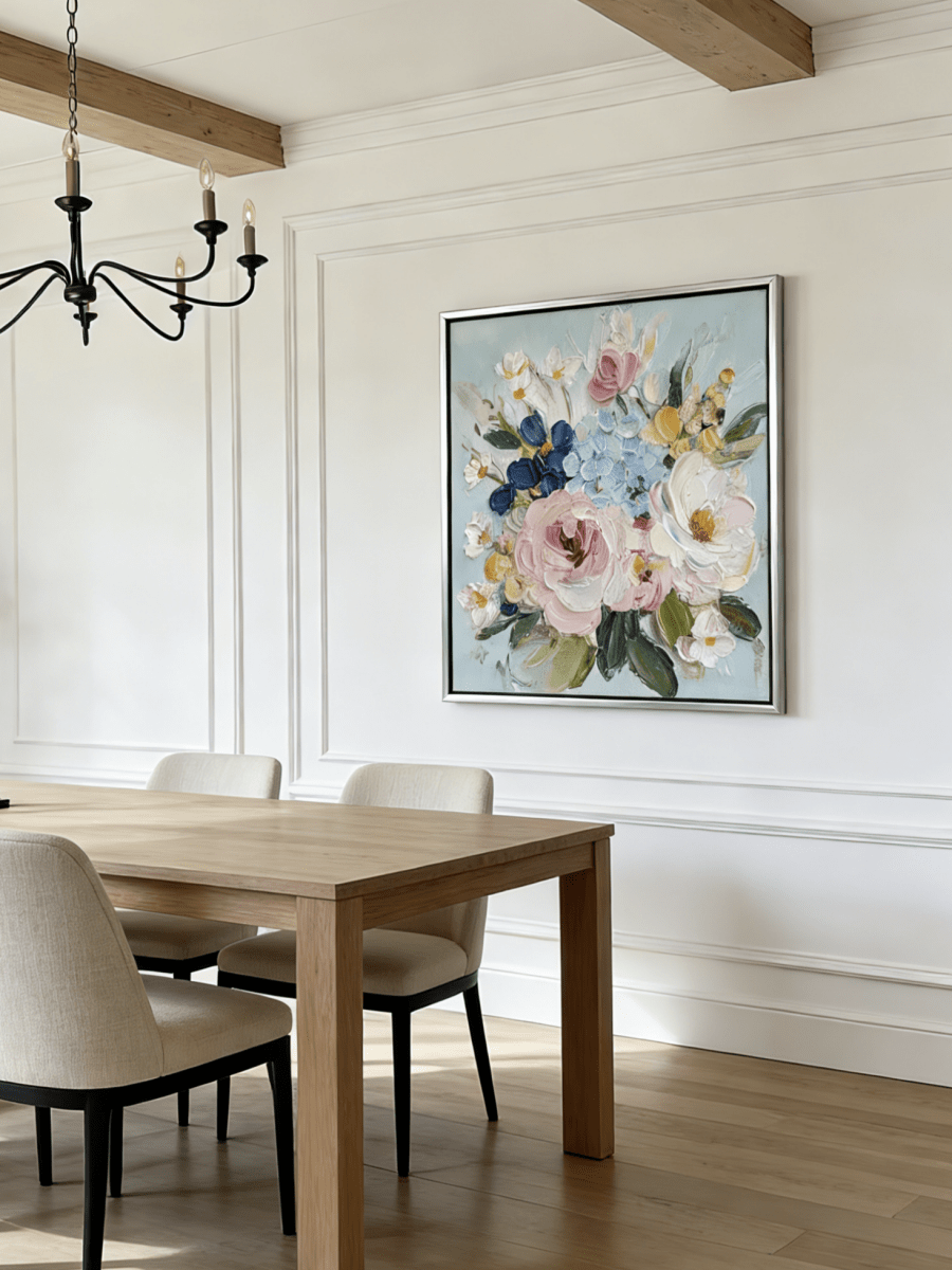 Large square 3D textured floral painting showing heavy impasto pink and white flowers on a light blue background in a modern living room.