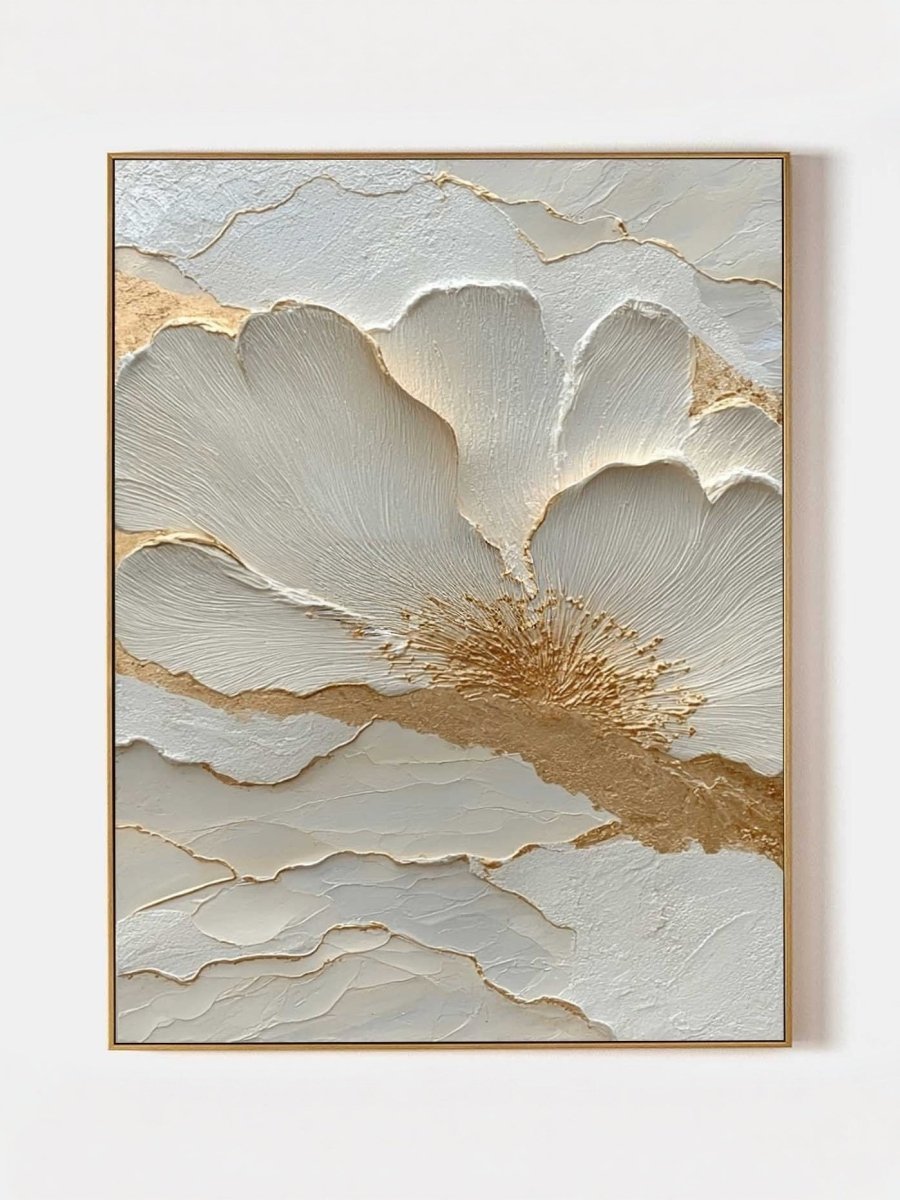 Close-up view of heavy 3D sculptural white flower petals with gold foil edges on canvas, hand-painted by Luna Xiao in a minimalist living room setting.