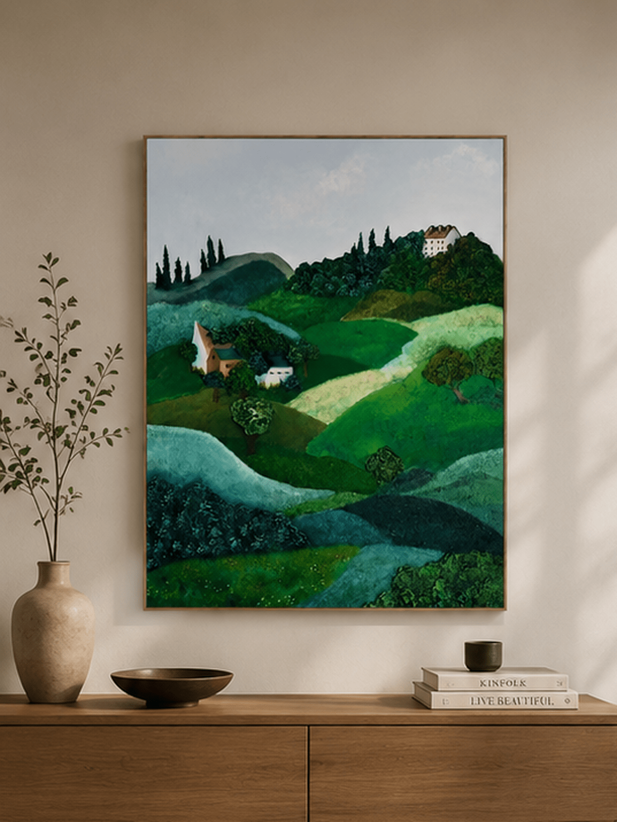 Rolling hills and countryside villa painting displayed above a wood console in a warm modern entryway