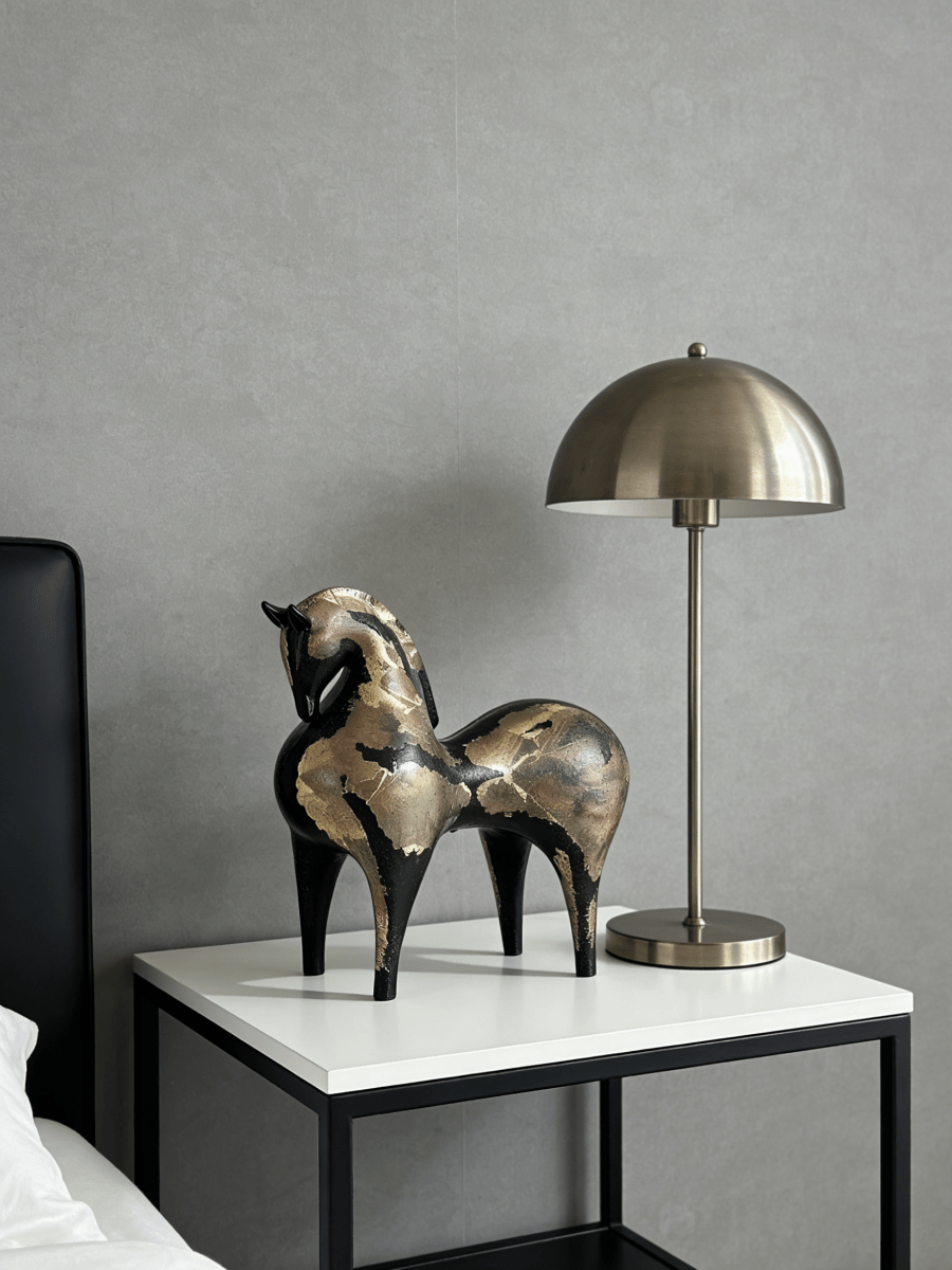 abstract horse sculpture with antique gold leaf finish on black resin, modern equestrian art for luxury home decor.