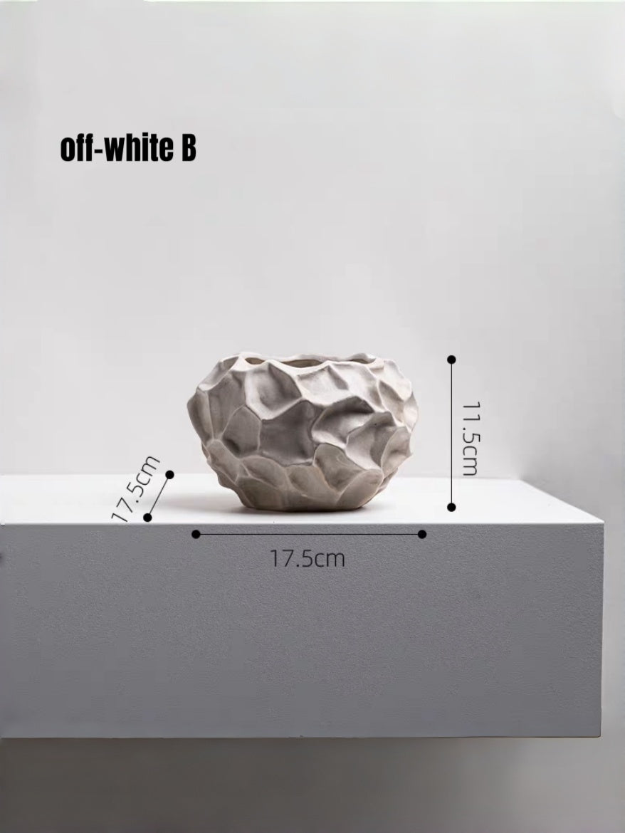 surrealist walking mushroom sculpture in bronze brown resin, paired with textured geometric vases on a bookshelf for modern home decor.