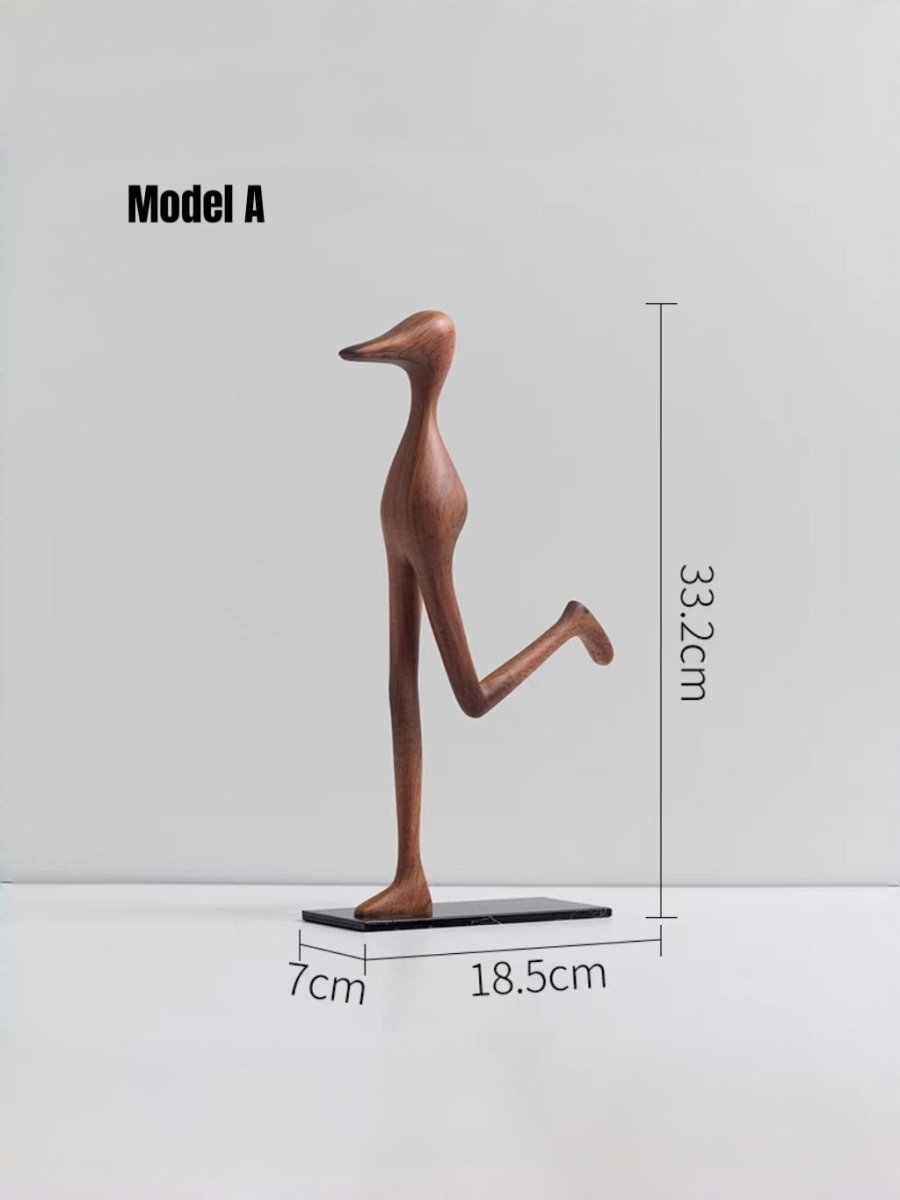 abstract biomorphic resin sculptures, sandstone texture stone art and wood finish running bird figurine on a bookshelf.