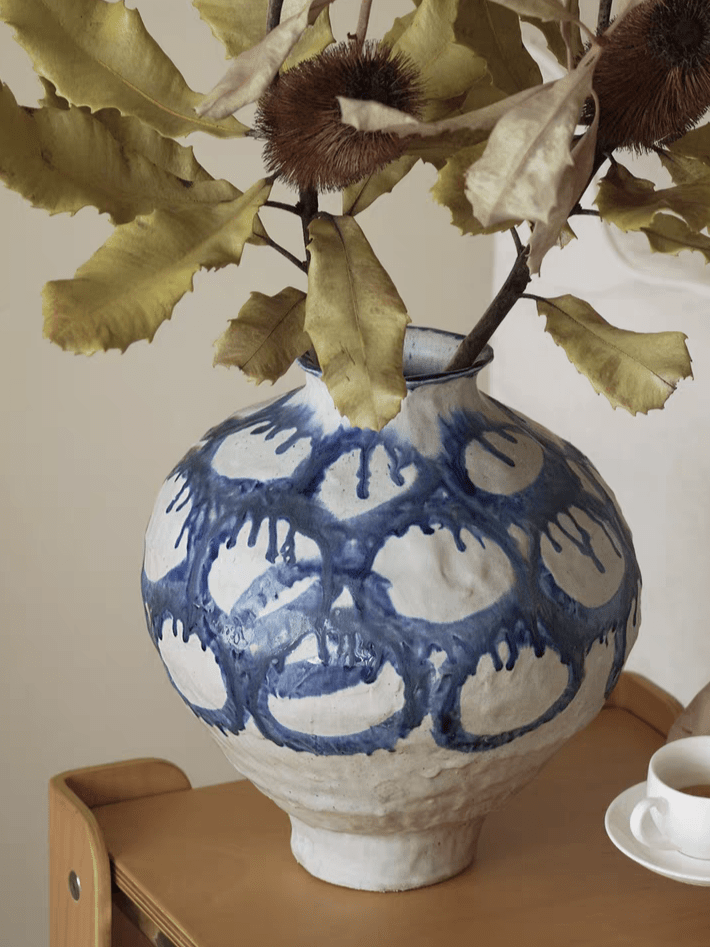 blue and white abstract drip glaze ceramic vase, hand-painted ink-wash style pottery sculpture for modern living room console.