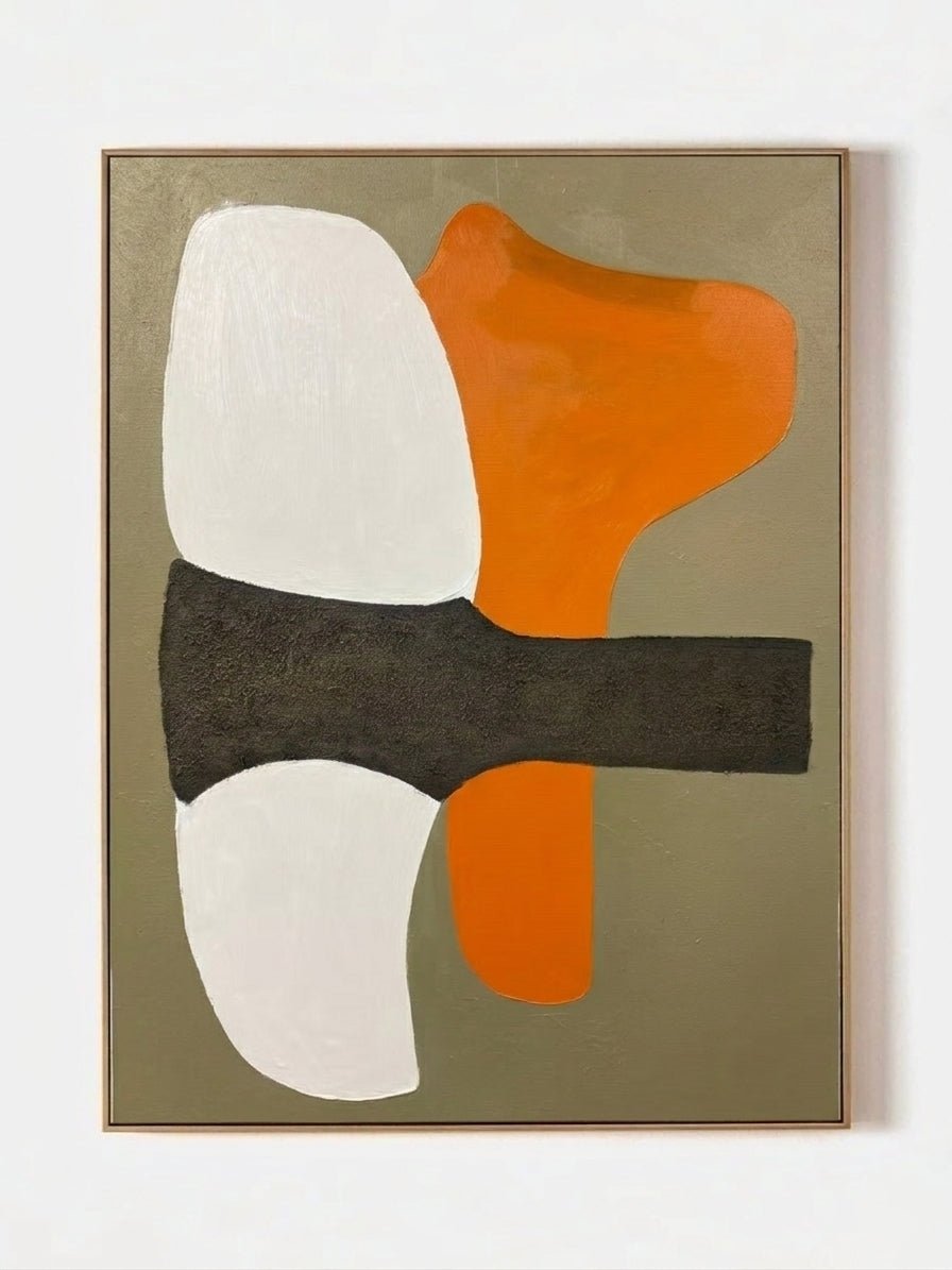 Hand-painted modern organic abstract painting featuring a vibrant orange shape and thick charcoal brushstroke on a sand background in a gold frame.