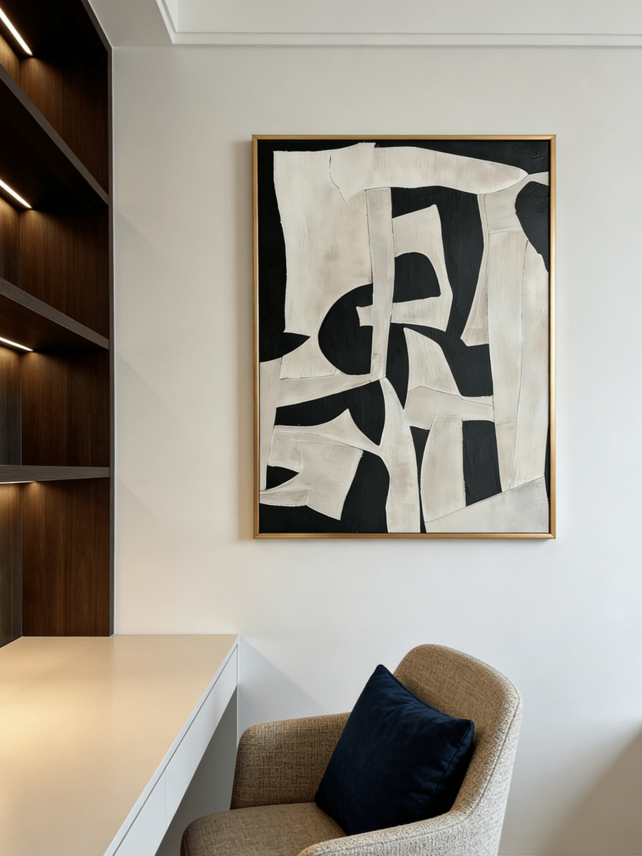 Large vertical hand-painted abstract painting with bold black and white geometric shapes and heavy impasto texture by Seraphina Rose in a modern luxury living room.