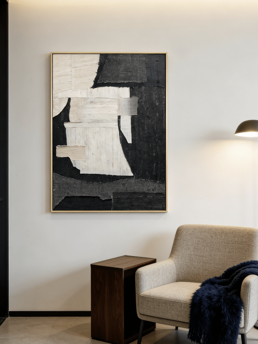 Large vertical hand-painted abstract painting with black and white textured blocks and fabric-like impasto by Seraphina Rose in a modern luxury living room.