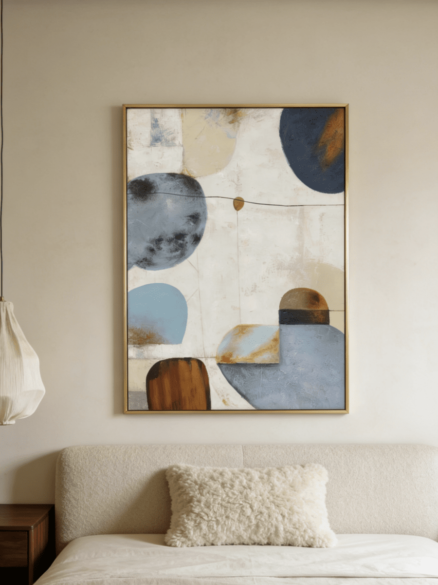 Hand-painted modern organic abstract painting featuring blue and brown geometric shapes with thick texture in a gold floater frame.