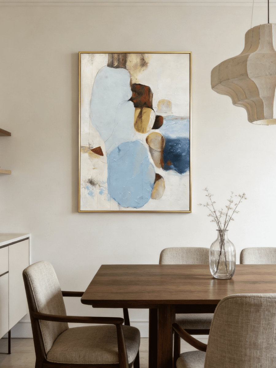 Hand-painted modern organic abstract painting featuring blue and brown stone-like shapes with heavy impasto texture in a gold frame.
