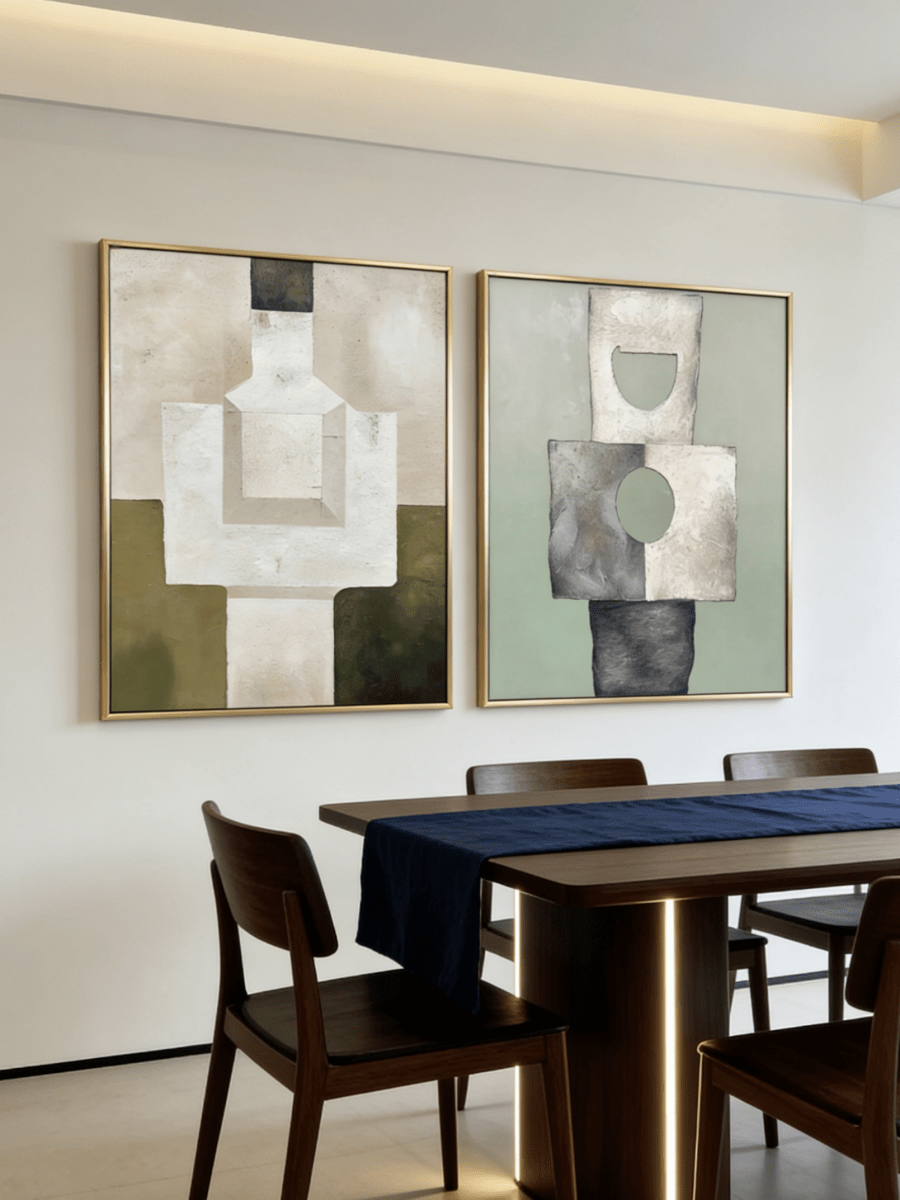 A pair of large vertical abstract paintings with geometric totem-like shapes in sage green, olive, and beige with visible heavy texture.