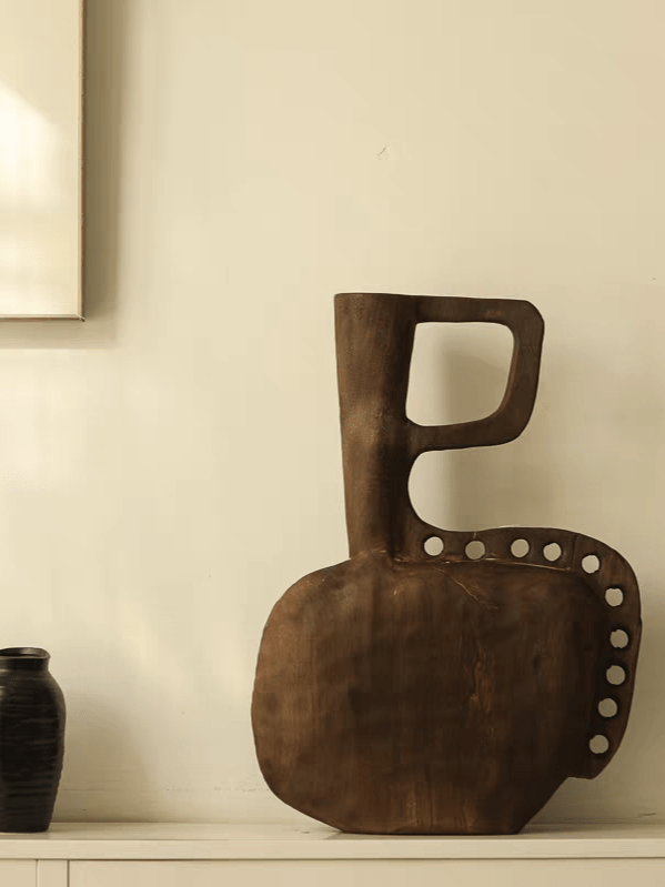 hand-carved modern primitive wood totem sculpture with dark walnut finish and hole details, large abstract wooden art for living room decor.