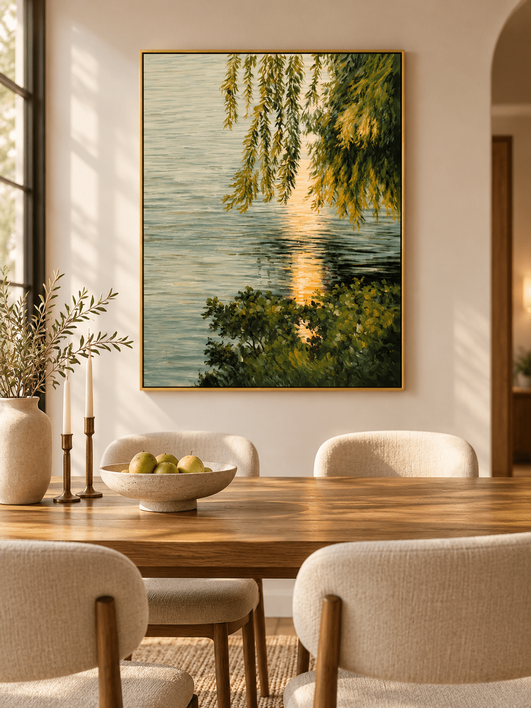 Impressionist lakeside landscape painting with golden water reflections displayed in a contemporary open dining room.