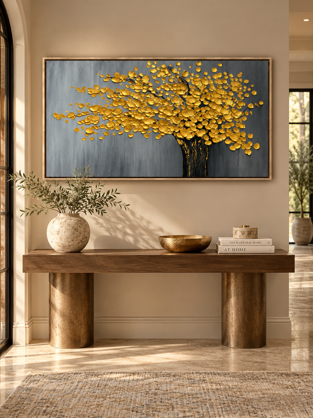 Textured gold tree wall art with a dark trunk and gray background displayed in a modern entryway.