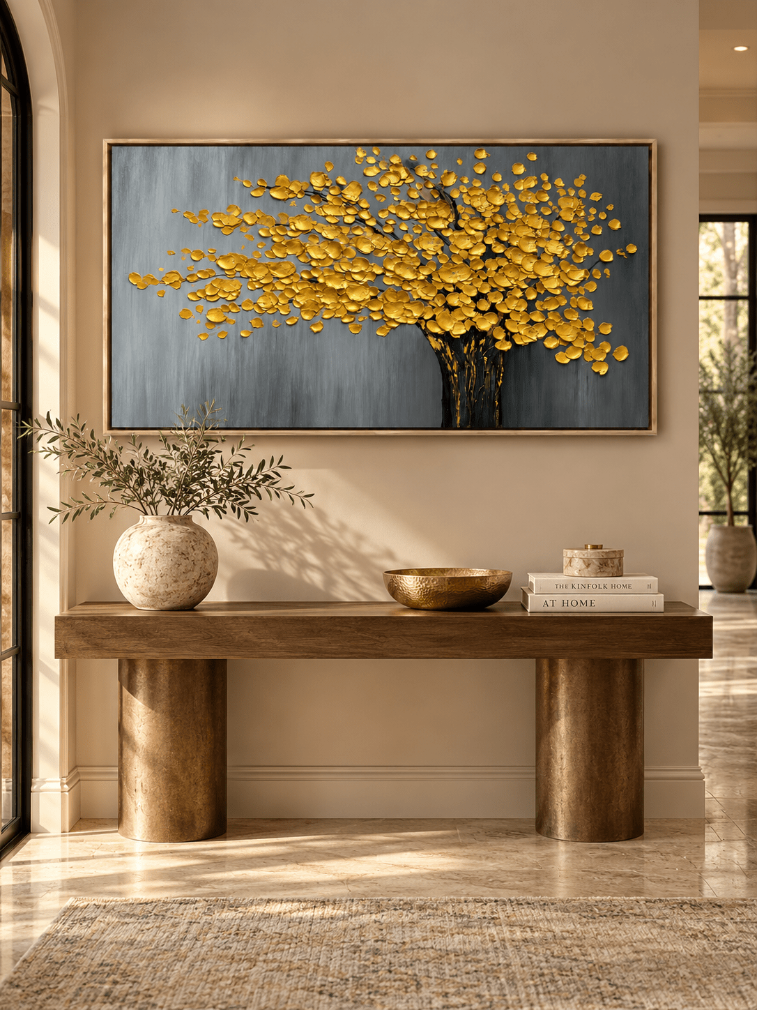 Textured gold tree wall art with a dark trunk and gray background displayed in a modern entryway.