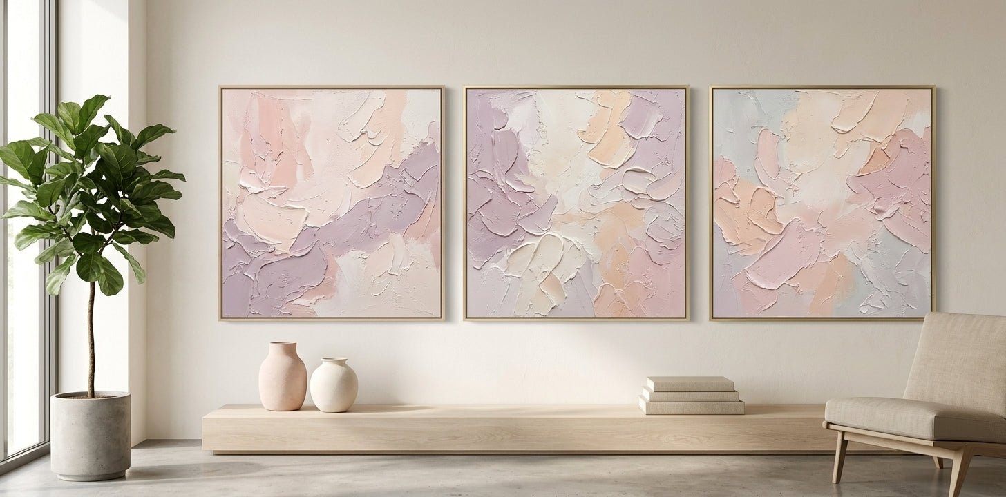 Soft minimalist bedroom interior featuring a large horizontal pastel-toned painting above a linen-covered bed.