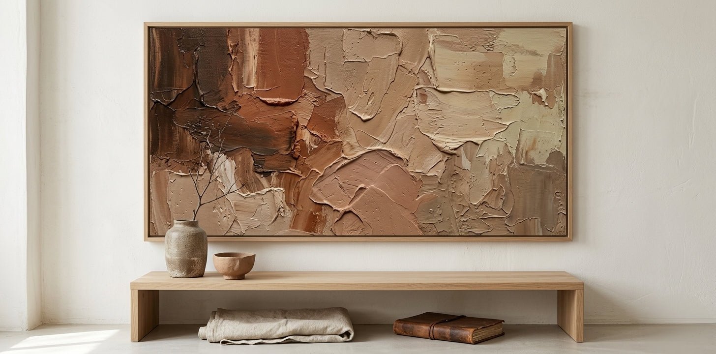 Minimalist organic modern living room featuring a large hand-painted wabi-sabi wall art in grounded terracotta tones.