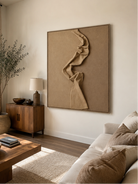 Neutral sculptural wall art displayed in an organic modern living room
