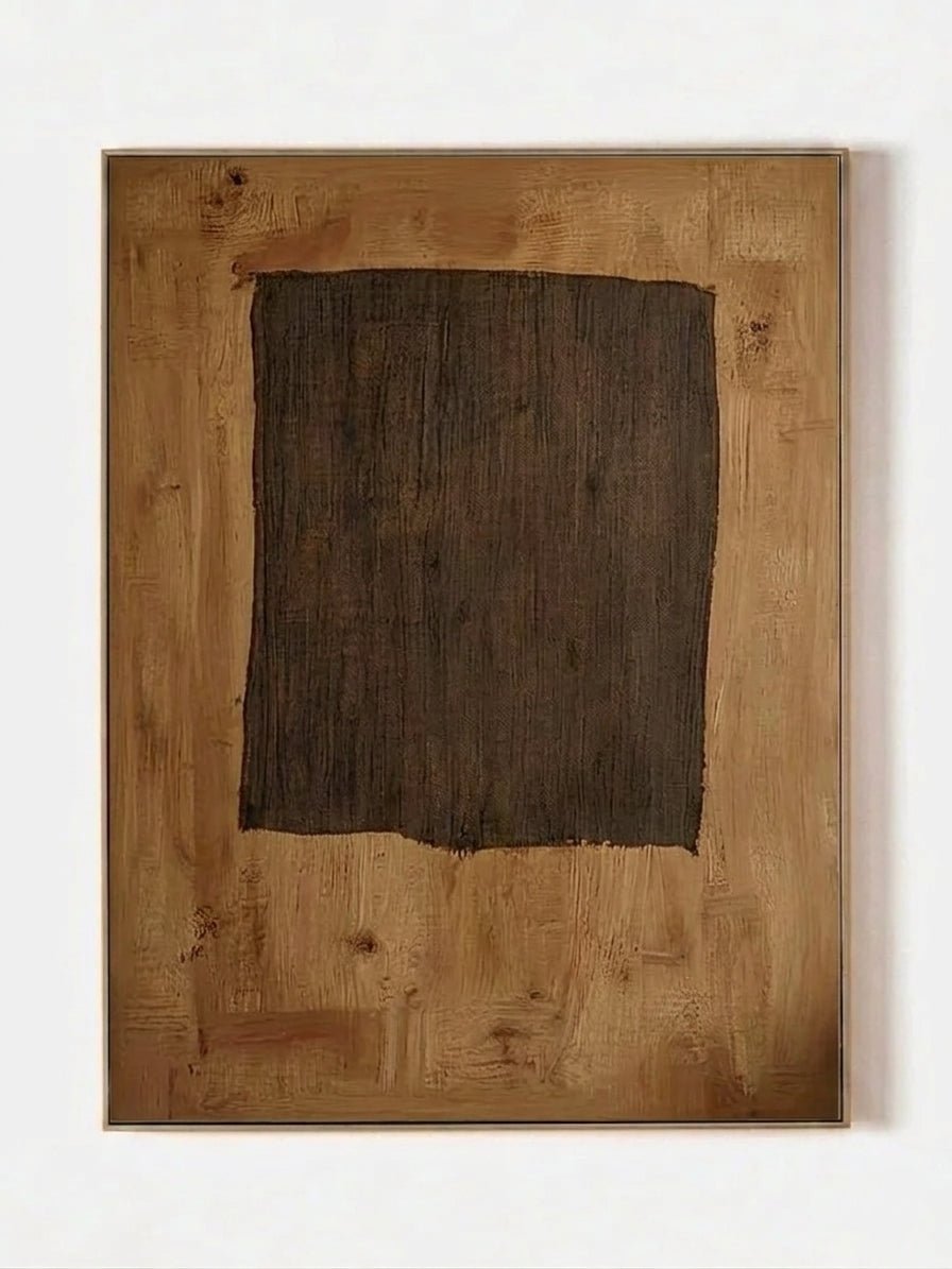 Large hand-painted abstract art by featuring a dark brown rectangle on a caramel ochre background with rich texture in a gold frame.