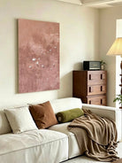 Hand-painted abstract bird wall art featuring white birds in flight over a textured blush pink and taupe background, contemporary canvas artwork for modern living room and bedroom decor.