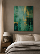 Teal and emerald green abstract wall art displayed above the bed in a sophisticated modern bedroom