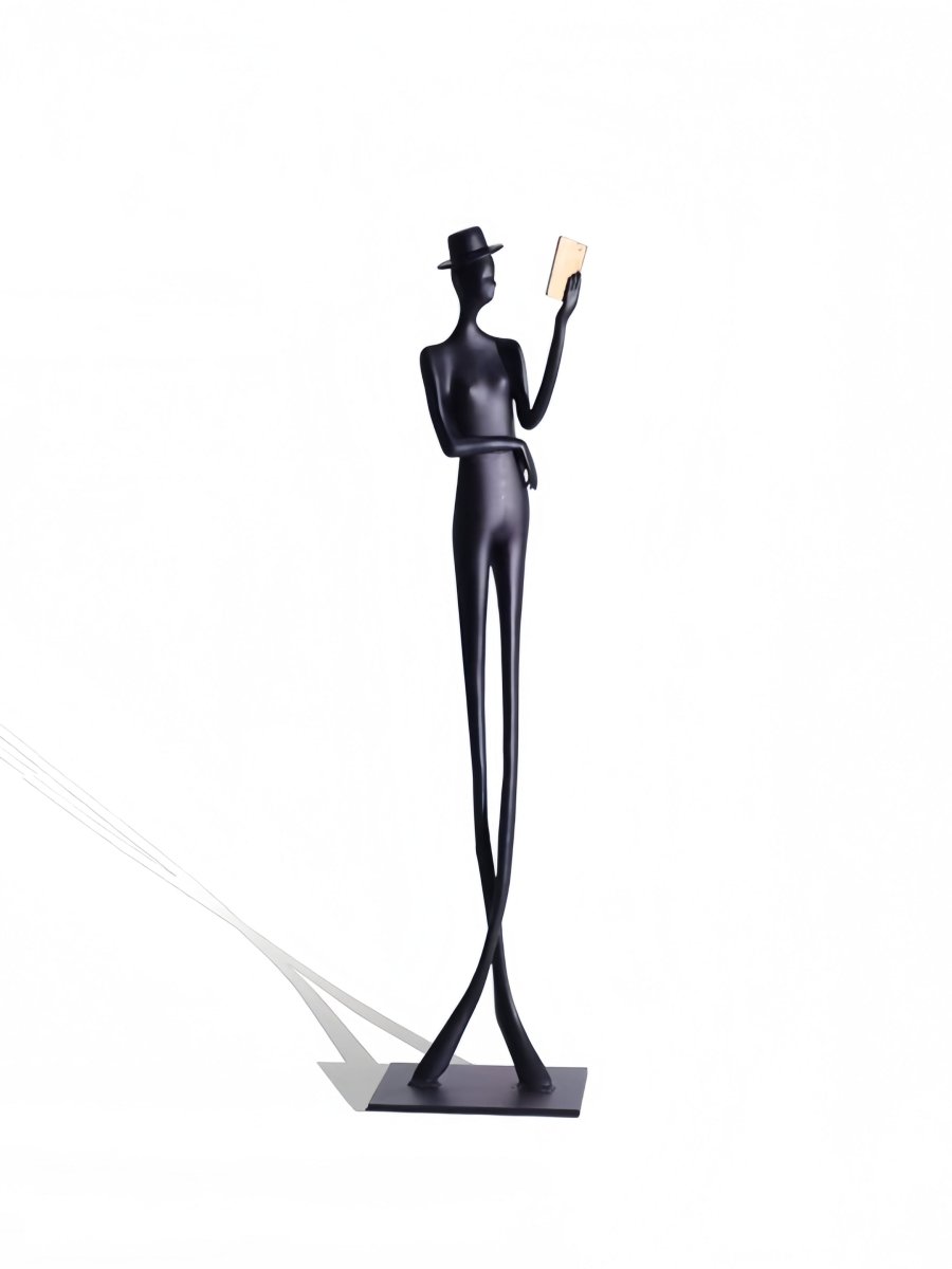 abstract male figure reading a gold book, 51cm tall matte black metal sculpture for home office shelf decor