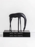 Modern minimalist drinking horse sculpture in matte black metal– elegant home decor for shelf, console, or desk styling