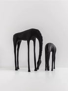Modern minimalist drinking horse sculpture in matte black metal– elegant home decor for shelf, console, or desk styling