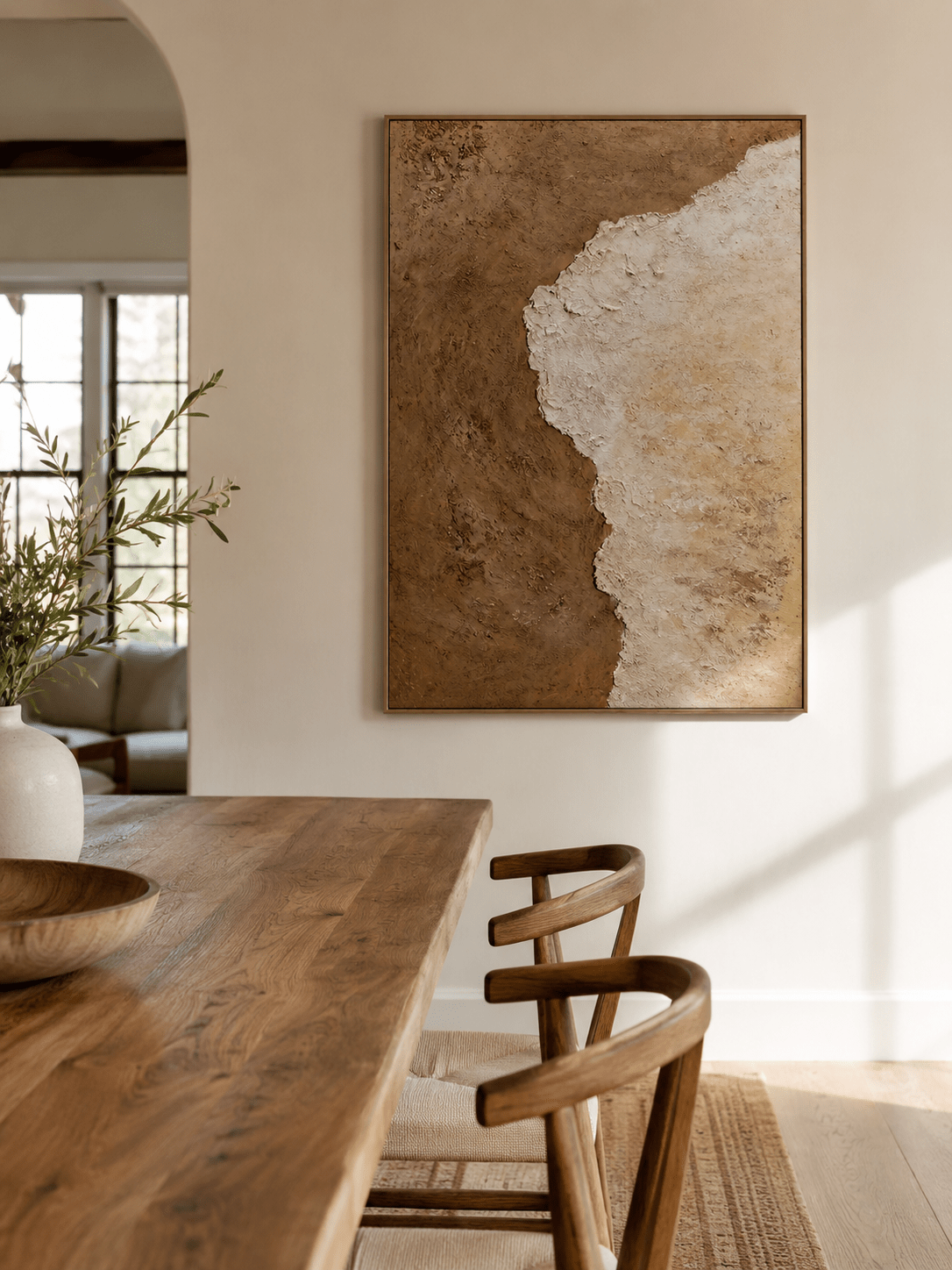 Earth-tone abstract wall art displayed in an organic modern living room