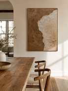 Earth-tone abstract wall art displayed in an organic modern living room