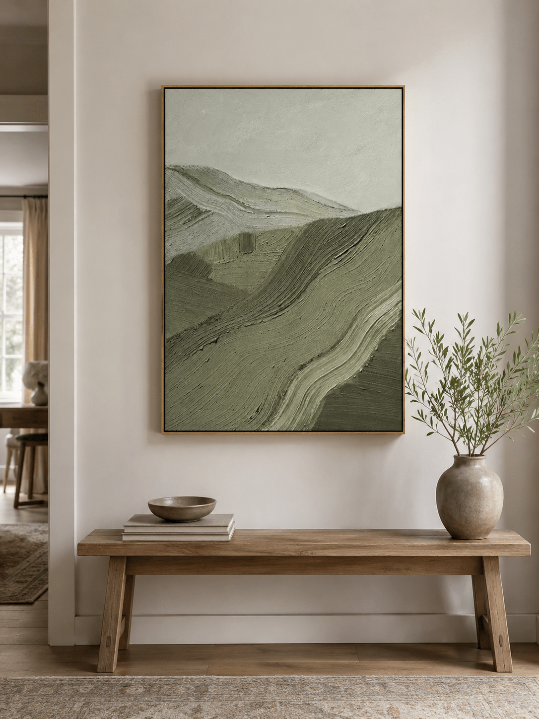Sage green landscape wall art in an organic modern living room