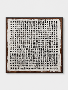 Hand-painted monochrome geometric wall art with black and white grid pattern by Eliot Vermeer