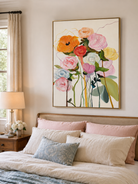 Pastel abstract flower painting displayed above the bed in a bright modern bedroom