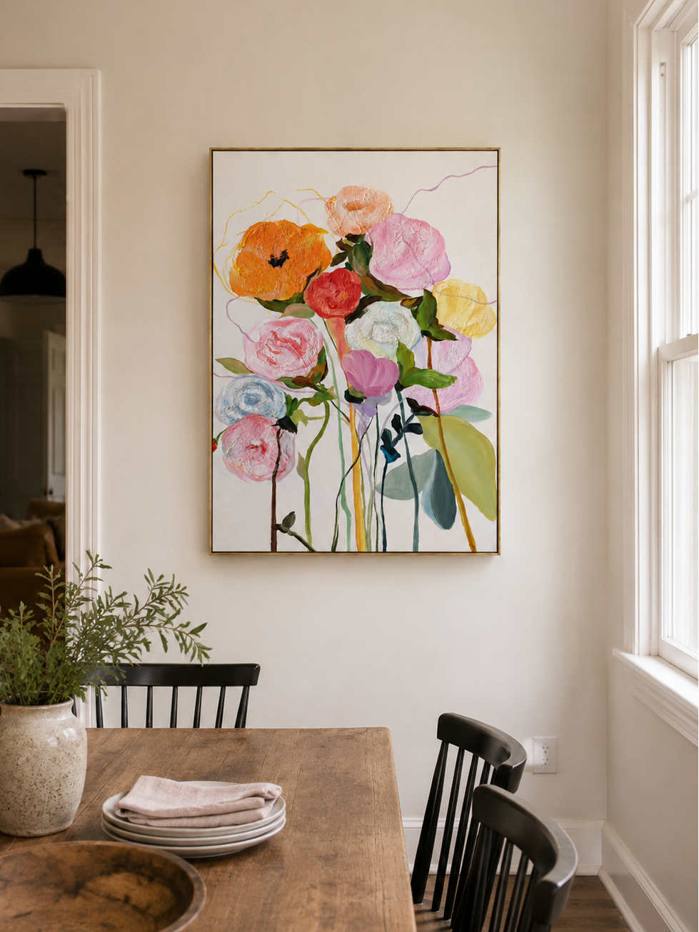 Colorful hand-painted floral wall art displayed in a modern open-plan dining room